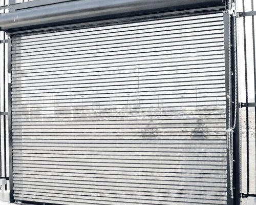 Perforated grill rolling shutter allowing visibility and airflow