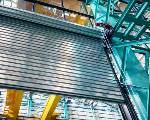 Motorized automatic rolling shutter for commercial building